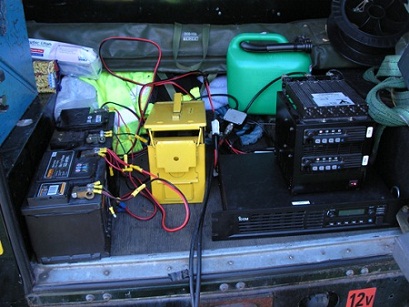 Batteries, a crossband (2m, 70cm) repeater (yellow box) and some PMR radios
