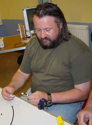 Chris making a coaxial plug connection